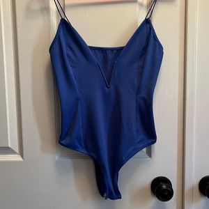 Blue, low cut body suit